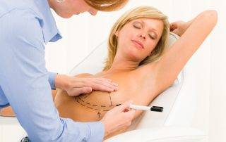 a woman having an Under or over the muscle boob job after learning about breast enlargement cost and opting for boob job finance